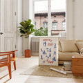 Red and blue city activity art in bright Scandinavian living room