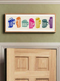 Coffee mug wall art shown above a modern kitchen counter