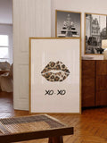 Leopard lips XO-XO portrait print in a gold frame in a warm wood interior