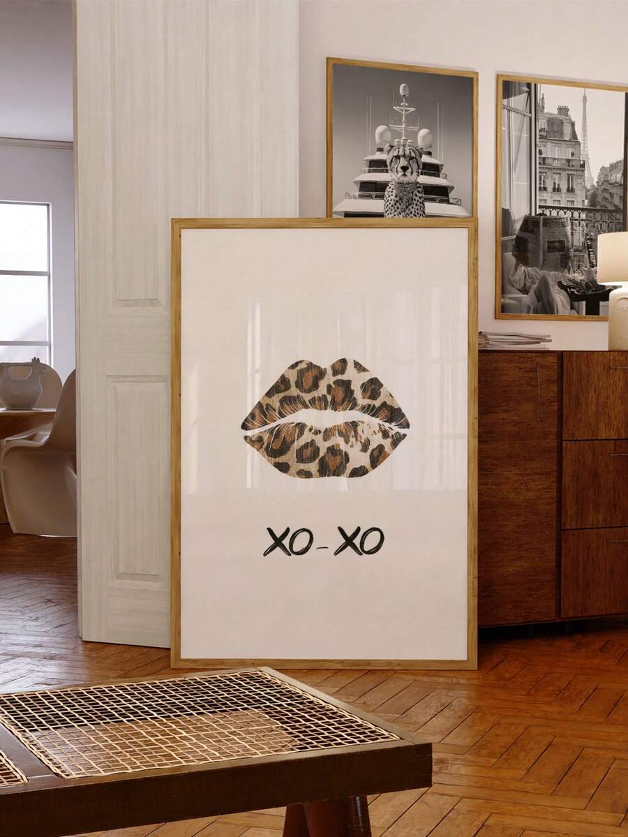 Leopard lips XO-XO portrait print in a gold frame in a warm wood interior