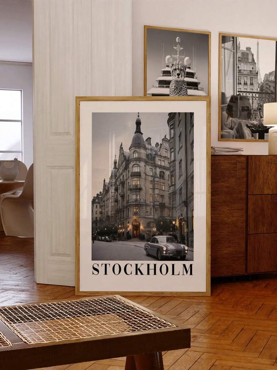 Stockholm cityscape with vintage car and STOCKHOLM text in a gold-framed portrait print