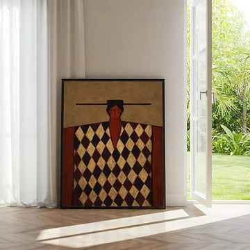 Abstract folk portrait canvas with diamond pattern in black frame by sunlit doorway