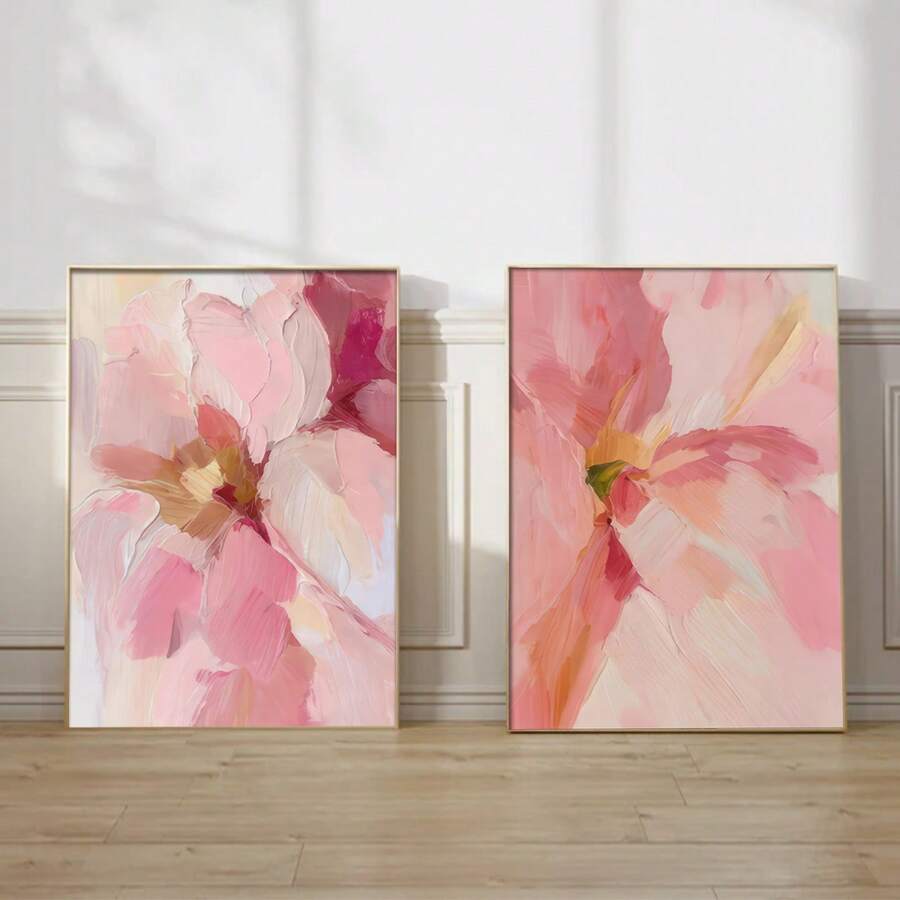 Pink abstract floral canvas pair displayed in a bright neutral room