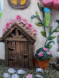 Mushroom house resin figurine with pink flower roofs and rustic fairy garden door