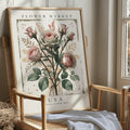 Vintage rose canvas artwork displayed on a light wood chair in a calm room