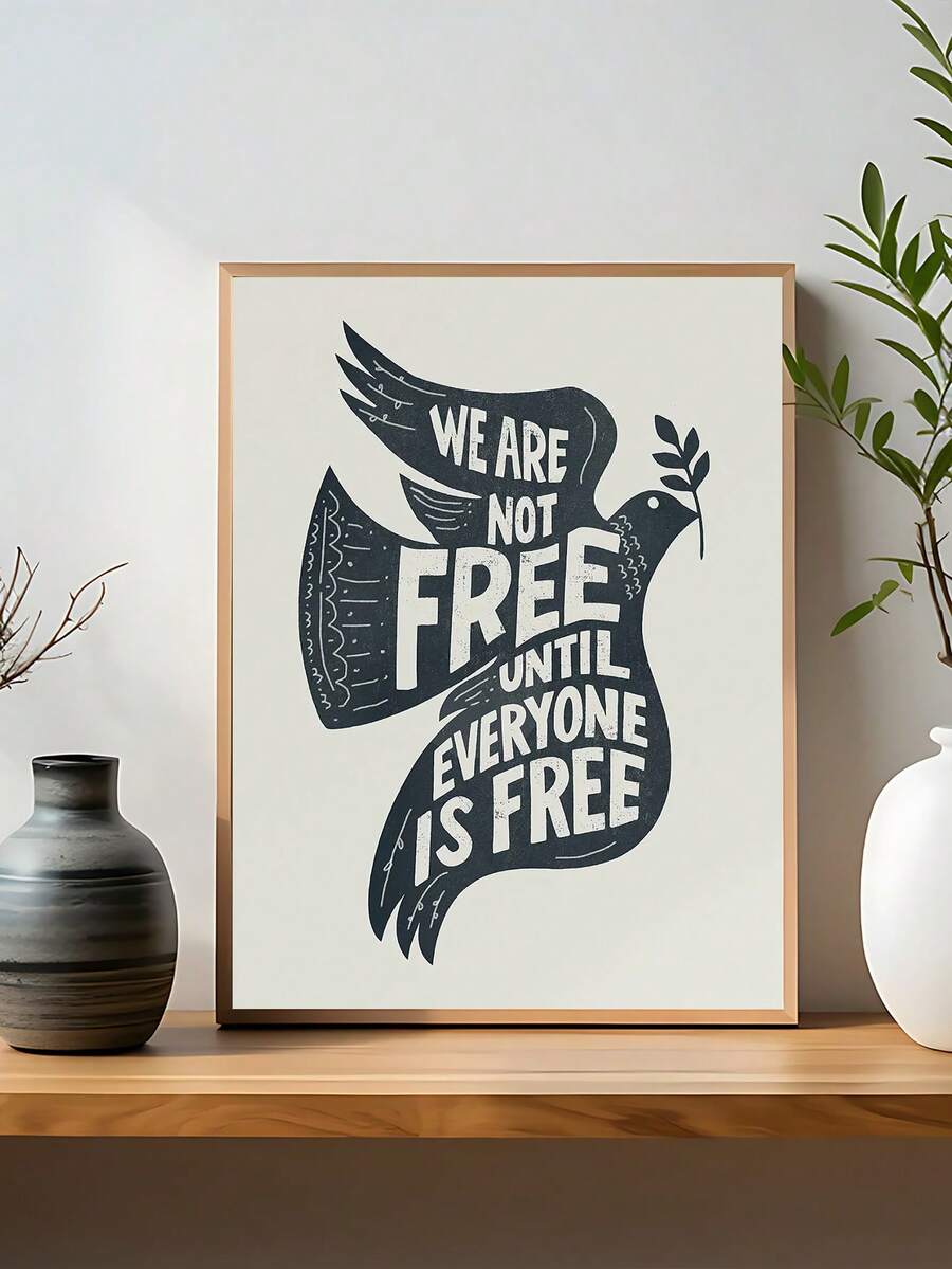 Peace dove freedom quote poster reading We Are Not Free Until Everyone Is Free on shelf