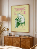 Large Tokyo Jazz Club cat piano poster above wood console in bedroom
