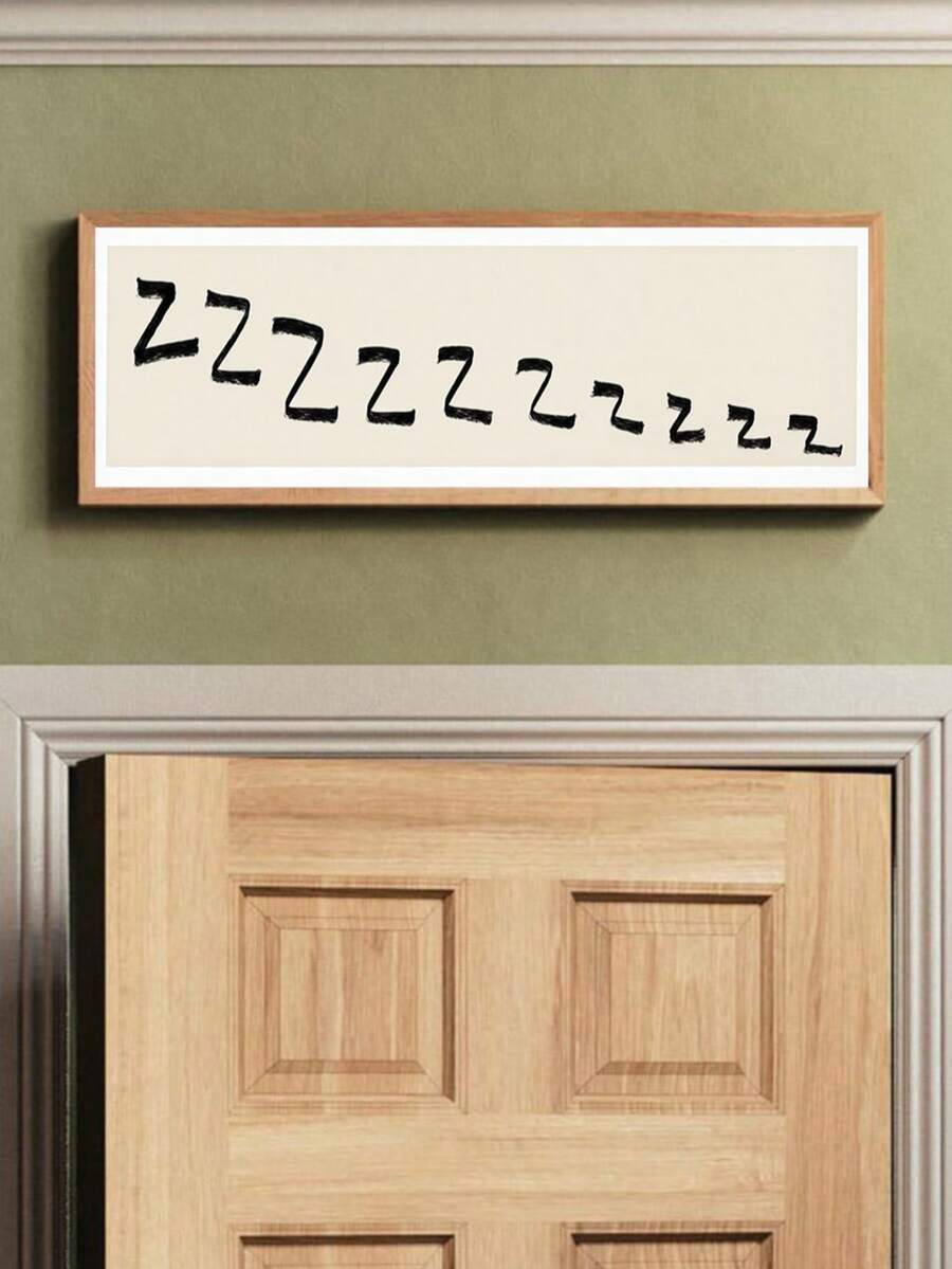 Framed horizontal Zzz sleep typography print with black brush letters on cream background