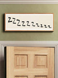 Minimal sleep wall art above doorway with natural wood frame and neutral bedroom style