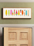 room mockup view of Panoramic framed wall art print with colorful popsicles and ice cream bars in bright yellow, pink, orange, teal, green and retro summer style.