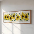 Close view of framed yellow sunflower print on sunlit wall