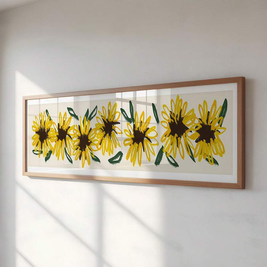 Close view of framed yellow sunflower print on sunlit wall