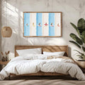 Coastal surfer canvas displayed over a bright bedroom with plants