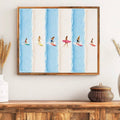 Surfer canvas artwork displayed above a white sofa and woven storage basket