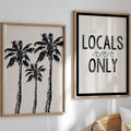 Framed palm tree line art and Locals Only wave lettering on an ivory wall