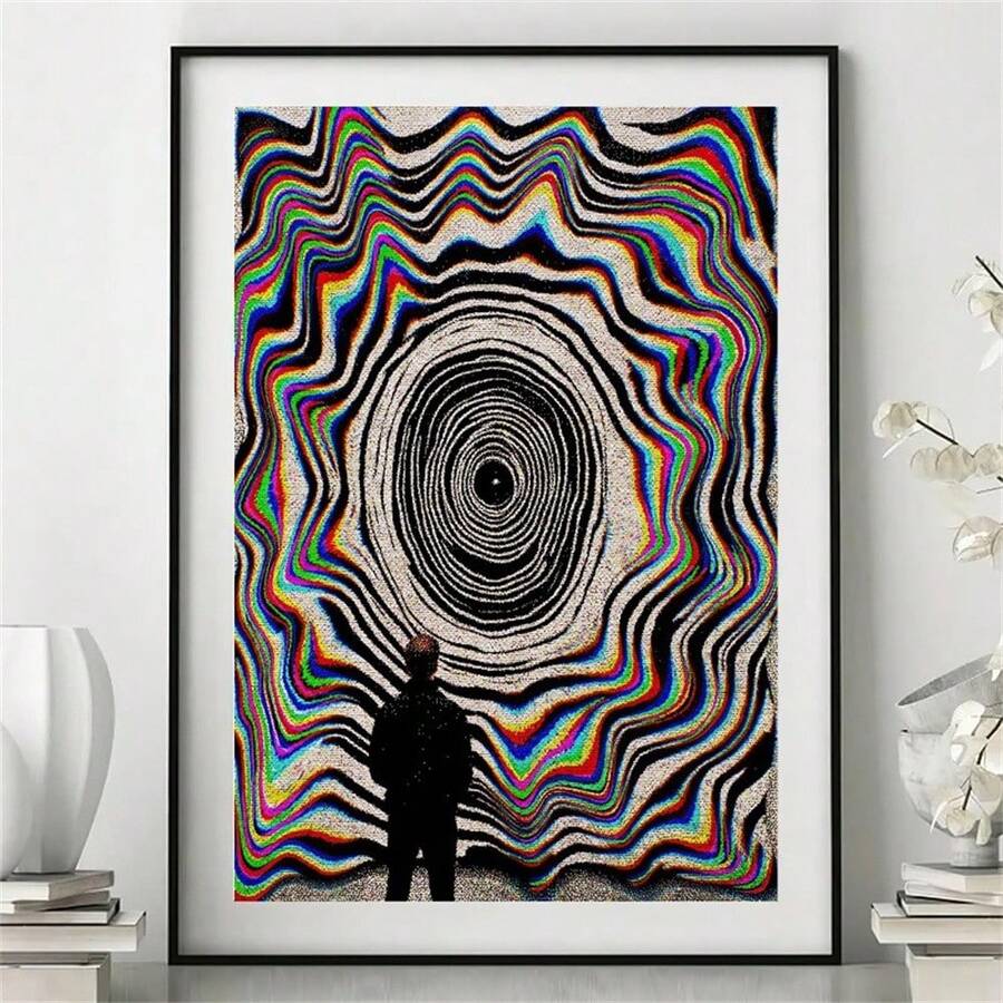 Black-framed retro optical art displayed against a pale wall with modern accessories