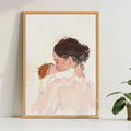 Wood-framed watercolor mother and baby poster displayed on a bright shelf