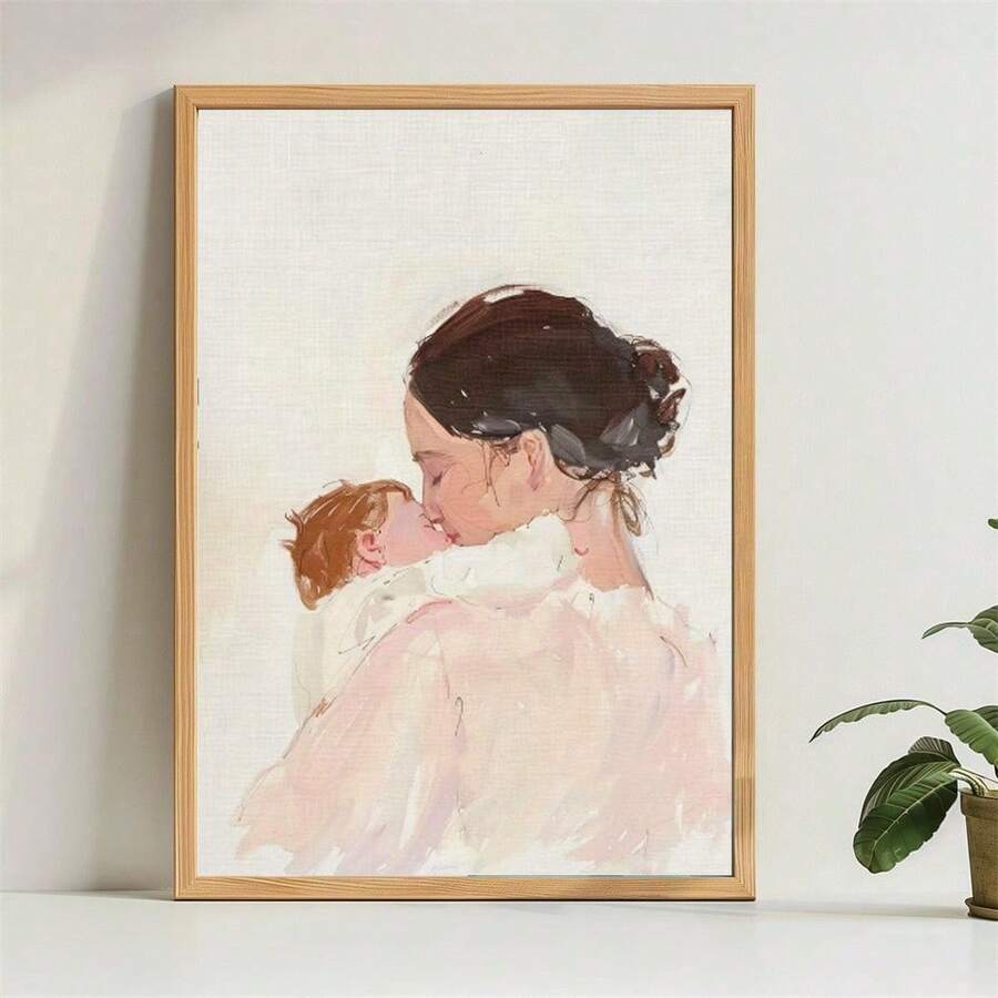Wood-framed watercolor mother and baby poster displayed on a bright shelf
