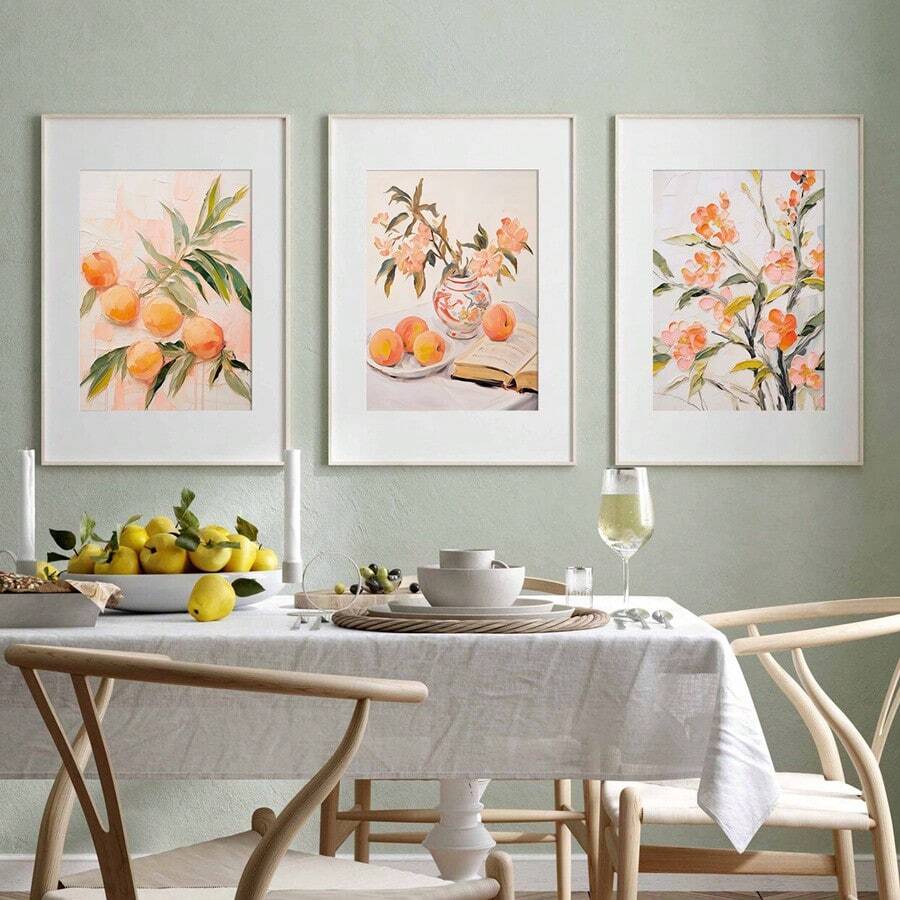 Styled display of vintage floral canvas wall art for a warm dining room