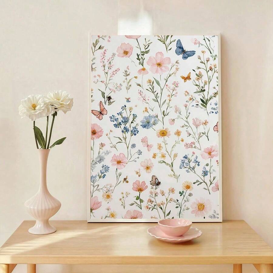 Light wood framed floral poster with pink blossoms and small blue wildflowers