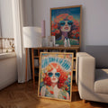 Colorful 70s flower woman poster in a wood frame near a sofa