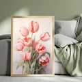 Blush tulip wall art displayed beside a bed with soft green bedding