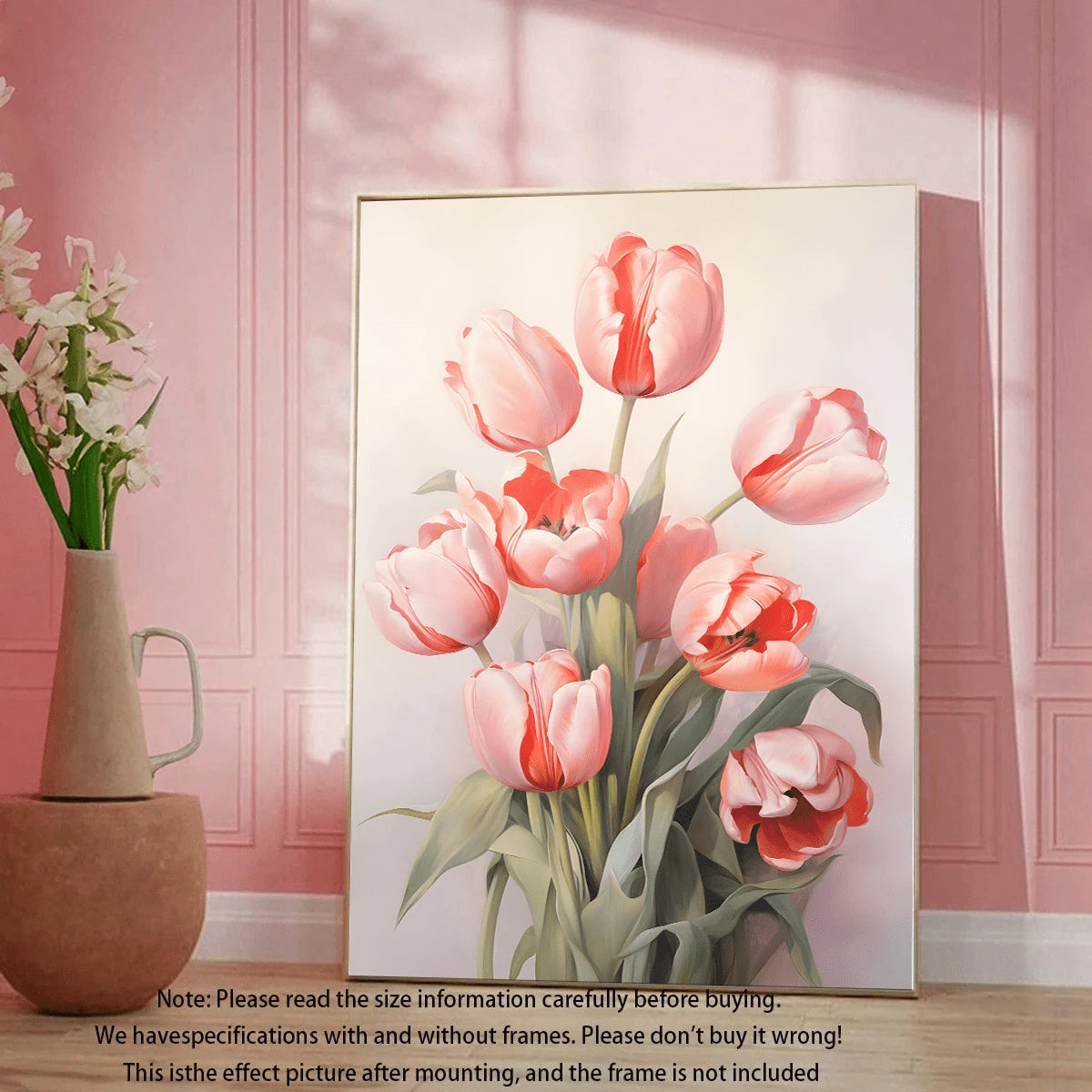 Pale pink tulip artwork in a light wood frame against a pink wall