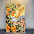 Mediterranean citrus village canvas poster displayed against a textured wall
