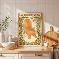 Framed orange tabby floral canvas poster displayed on a kitchen counter