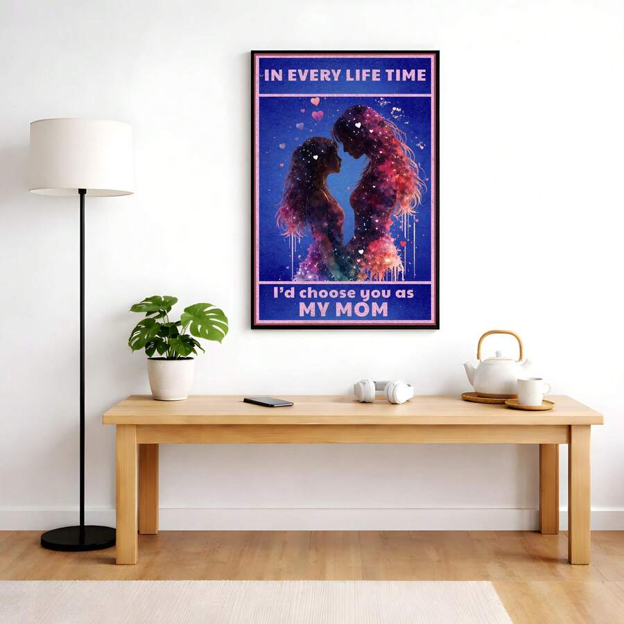 Framed emotional Mom canvas displayed above a light wood console with a potted plant