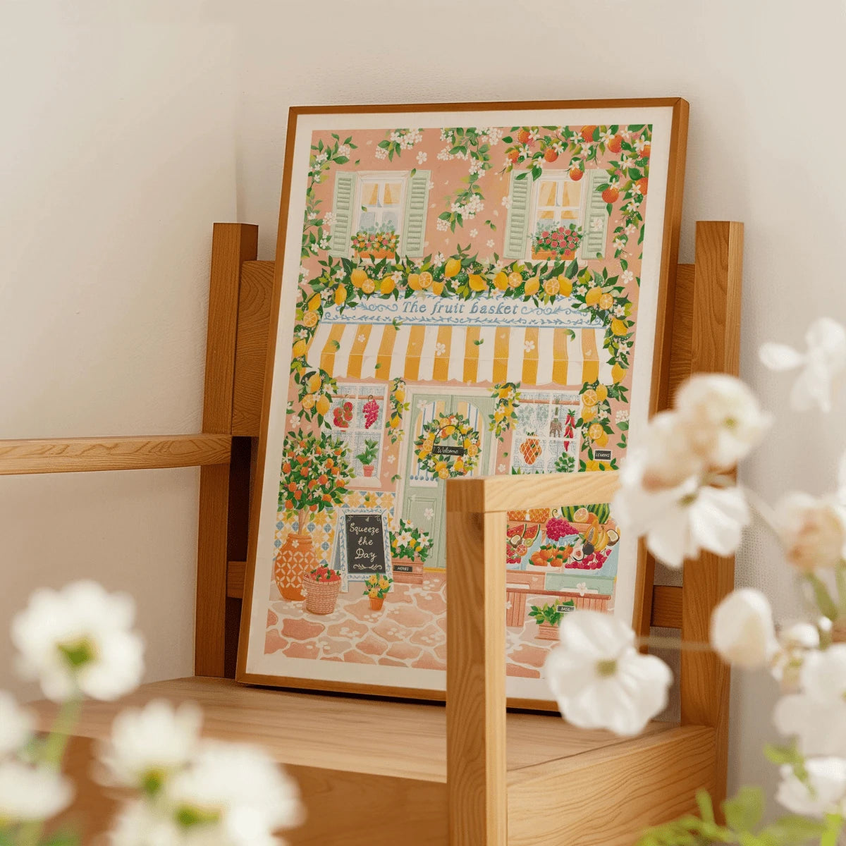 Citrus fruit storefront wall art displayed on a wood chair