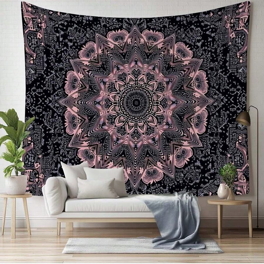 Black and pink mandala tapestry used as large wall hanging behind daybed