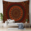 Rust orange mandala tapestry behind white daybed