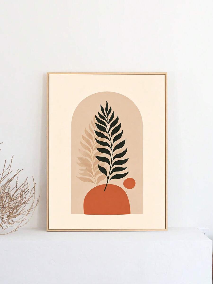 Minimalist fern artwork in a light frame above a white console