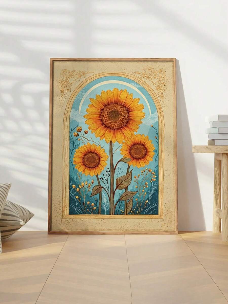 Framed sunflower floral poster leaning beside a light wood table