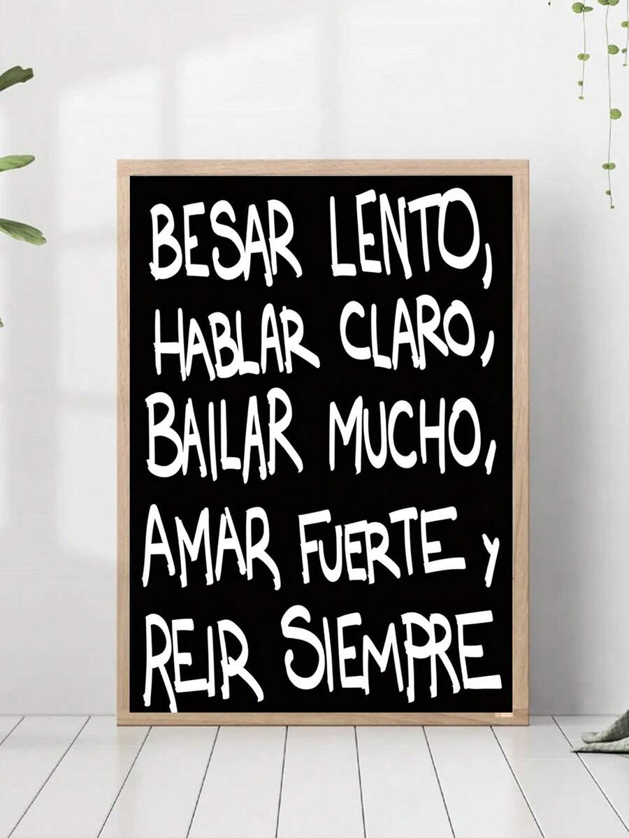 Framed black quote canvas styled in a bright neutral room