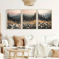 Blush sunset mountain triptych above a bright neutral sofa