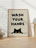 Hanging sage canvas with black cat and handwashing message beside bedside table