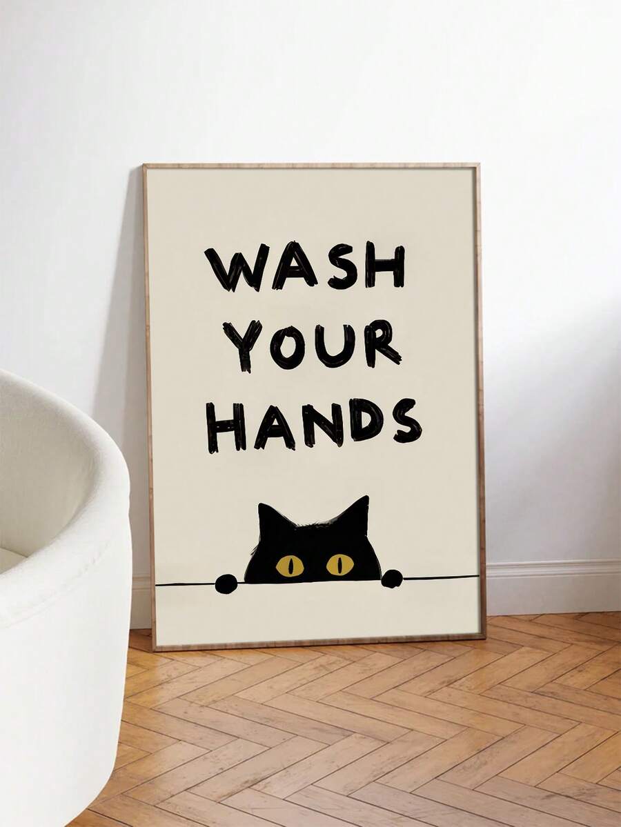 Framed black cat handwashing poster leaning beside a white bathtub