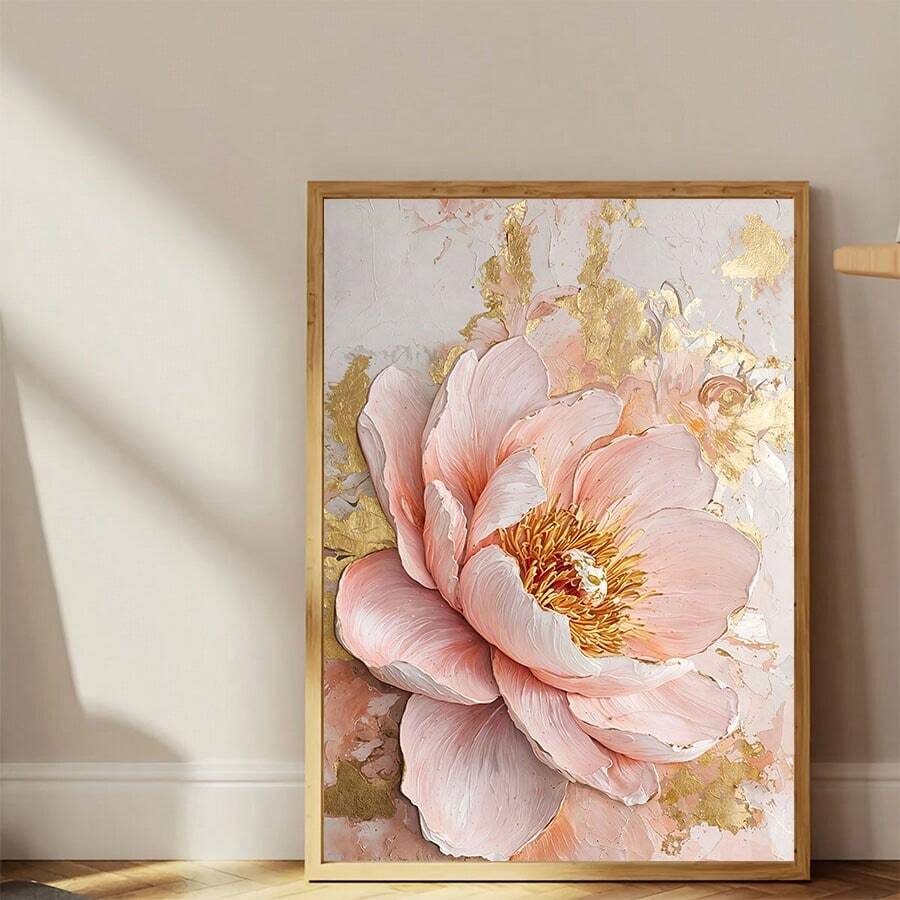 Large blush pink peony canvas with gold accents leaning against a pale wall