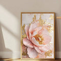 Large blush pink peony canvas with gold accents leaning against a pale wall