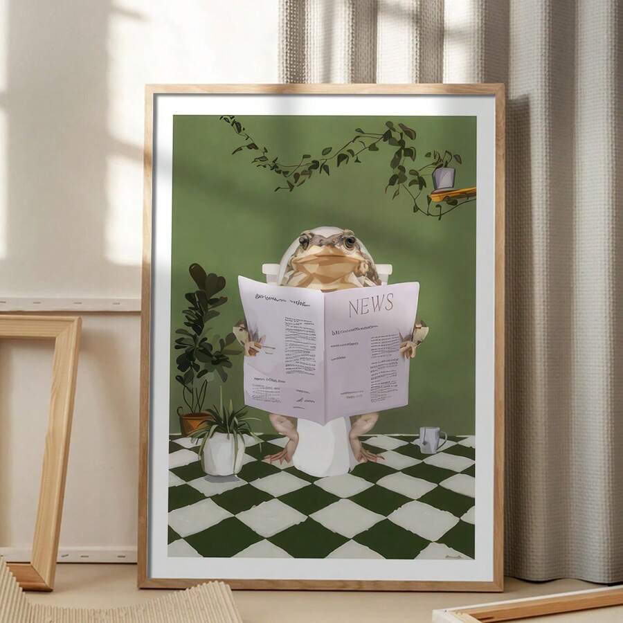 Framed whimsical frog bathroom wall art displayed beside a sink