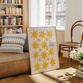 Inspirational yellow flower poster styled by a living room sofa
