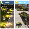 Moon star projector lights glowing on lawn with warm celestial pattern shadows
