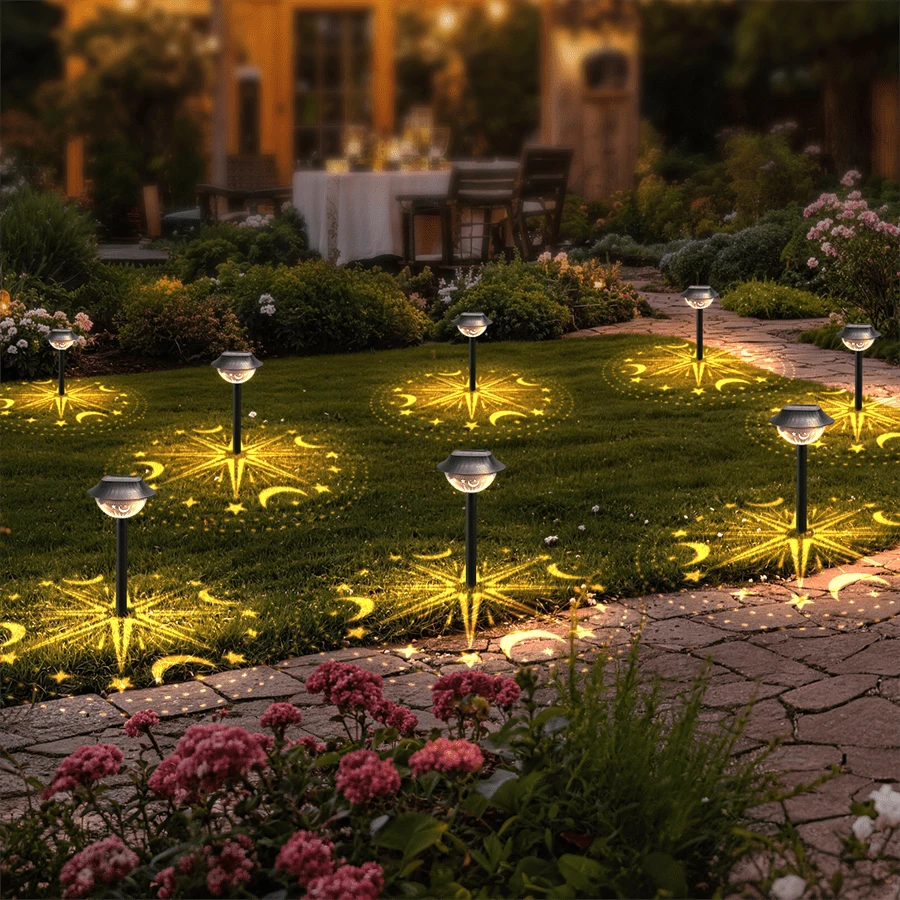 Lawn decor solar projector installed in grass with moon star firework pattern