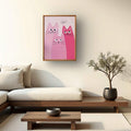 Pink cartoon cats wall art in wood frame