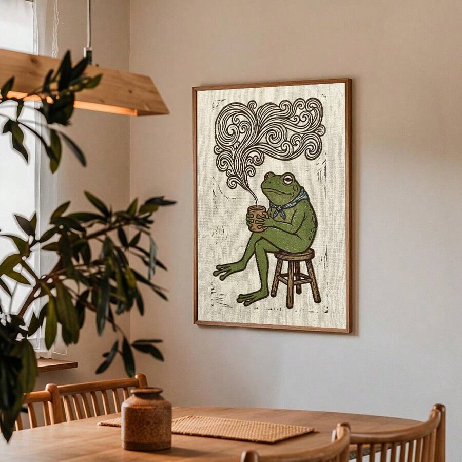 Frog drinking coffee canvas wall art with swirling steam and blue scarf.