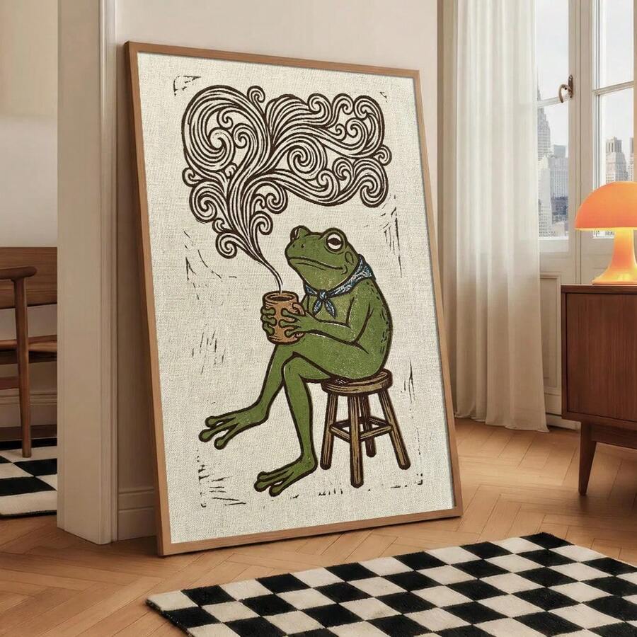 Frog drinking coffee canvas wall art with swirling steam and blue scarf.