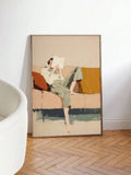 Large framed reader figure wall art leaning on white wall over herringbone floor