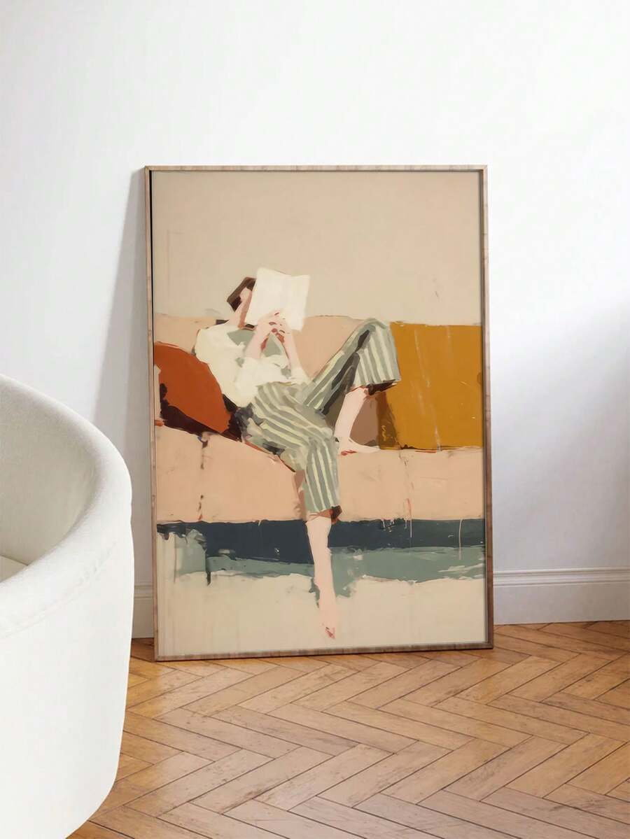 Large framed reader figure wall art leaning on white wall over herringbone floor